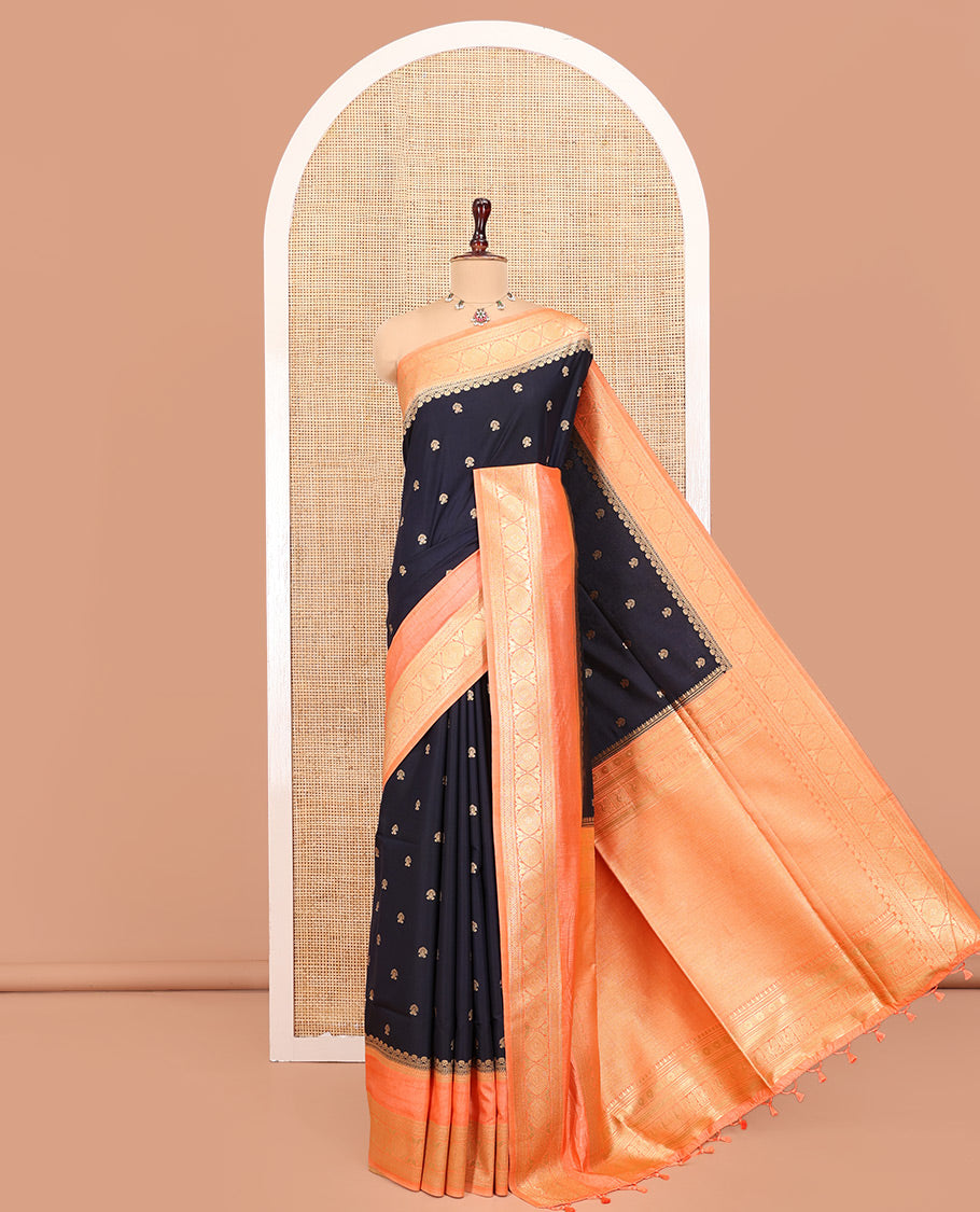Navy Blue Dupion Silk Saree, Adorned with Buttas All Over Its Body, Complemented by Contrast Traditional Border of Paisleys and Chakram Designs, Intricately Designed Pallu, and Paired with a Contrast Blouse