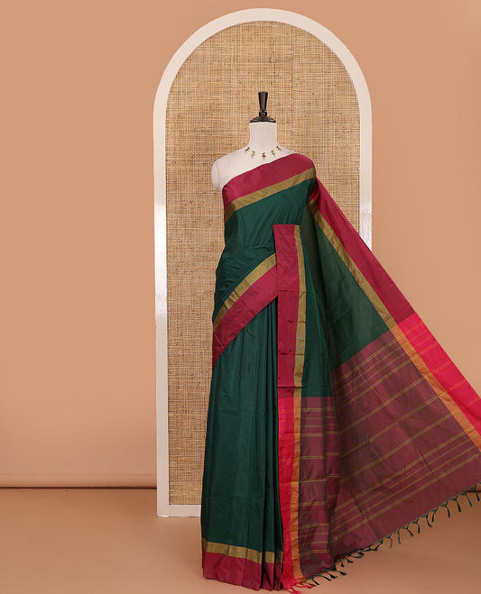 Bottle green full-plain semi-soft saree, contrast satin border of zari stripes, striped pallu & contrast plain blouse