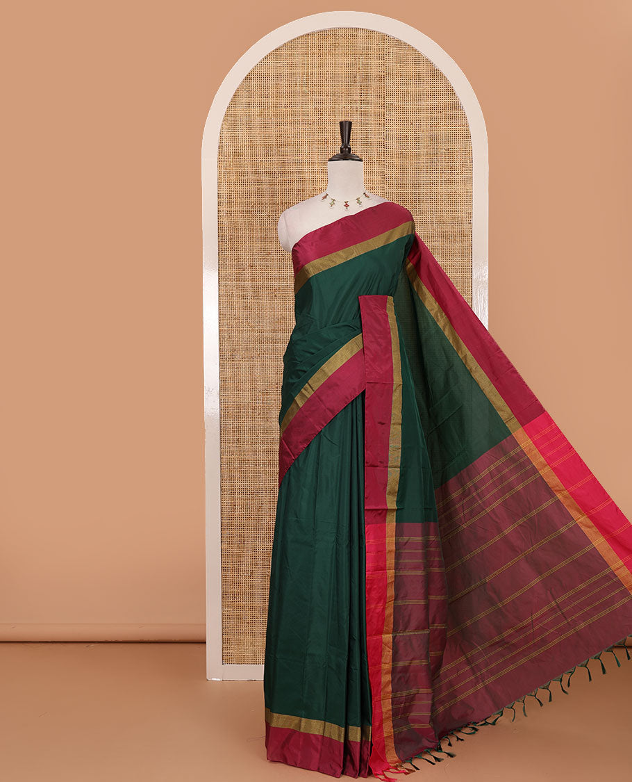 Bottle green full-plain semi-soft saree, contrast satin border of zari stripes, striped pallu & contrast plain blouse
