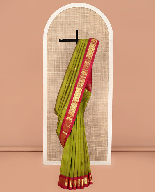 Green Kanchipuram Silk Saree, Decorated with Manga Buttas on Its Body, Complemented by a Contrast One-Sided Korvai Border of Thilakam Mokku, Banaras, Diamond and Floral Creeper Designs, Pallu of Manga Designs, and Comes Without a Blouse