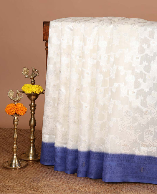 Cream with blue thread weaving, zari butta banaras brasso saree with contrast thread border & thread weaving pallu along with butta design blouse
