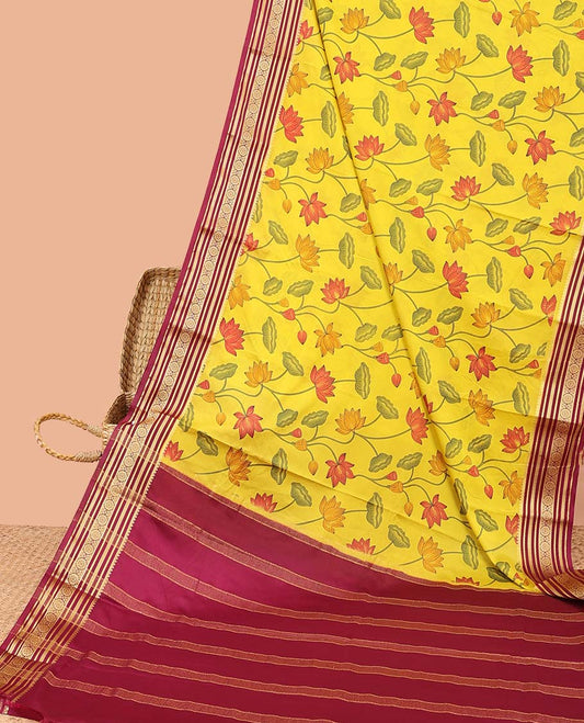 Yellow Pichwai-style floral vine printed semi-banaras printed saree, contrast traditional design border & striped pallu 