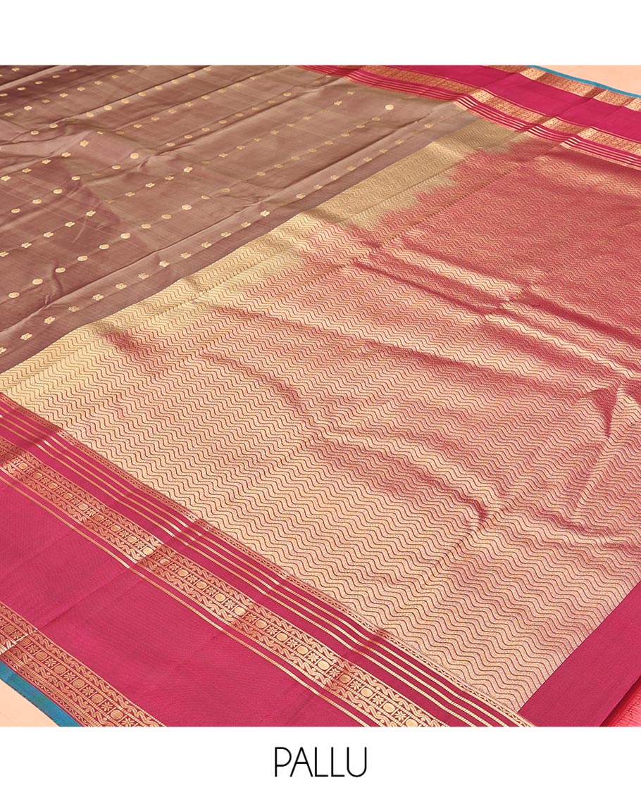 Brown Vasundhara Silk Mix Saree, Enriched with Zari Buttas All Over Its Body, Complemented by Contrast Varisai Pettu Border of Neli, Muthu, Star Kamalam, and Rudraksham Designs, Vanki Design Pallu, and Paired with a Contrast Blouse
