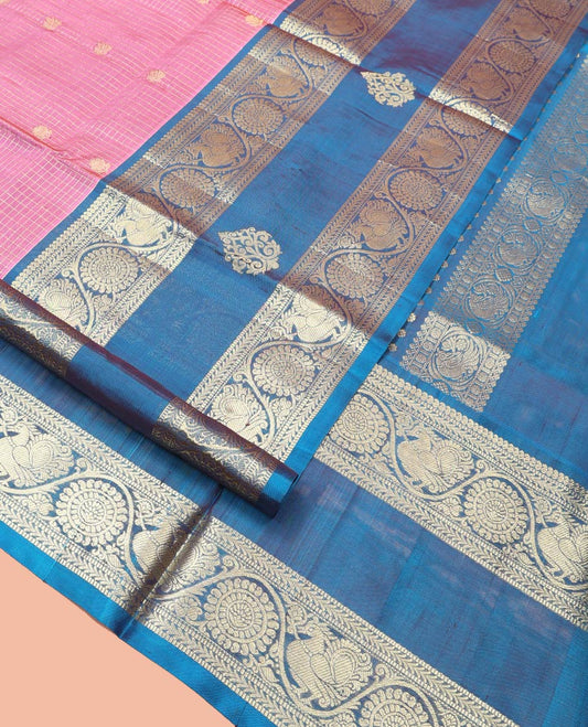 Pink Venkatagiri Silk Saree, Enlivened with Zari Buttas Enclosed Checks All Over Its Body, Complemented by a Contrast Traditional Zari Design Border of Peacock-Chakram Designs, Traditional Design Pallu, and Paired with a Contrast Blouse
