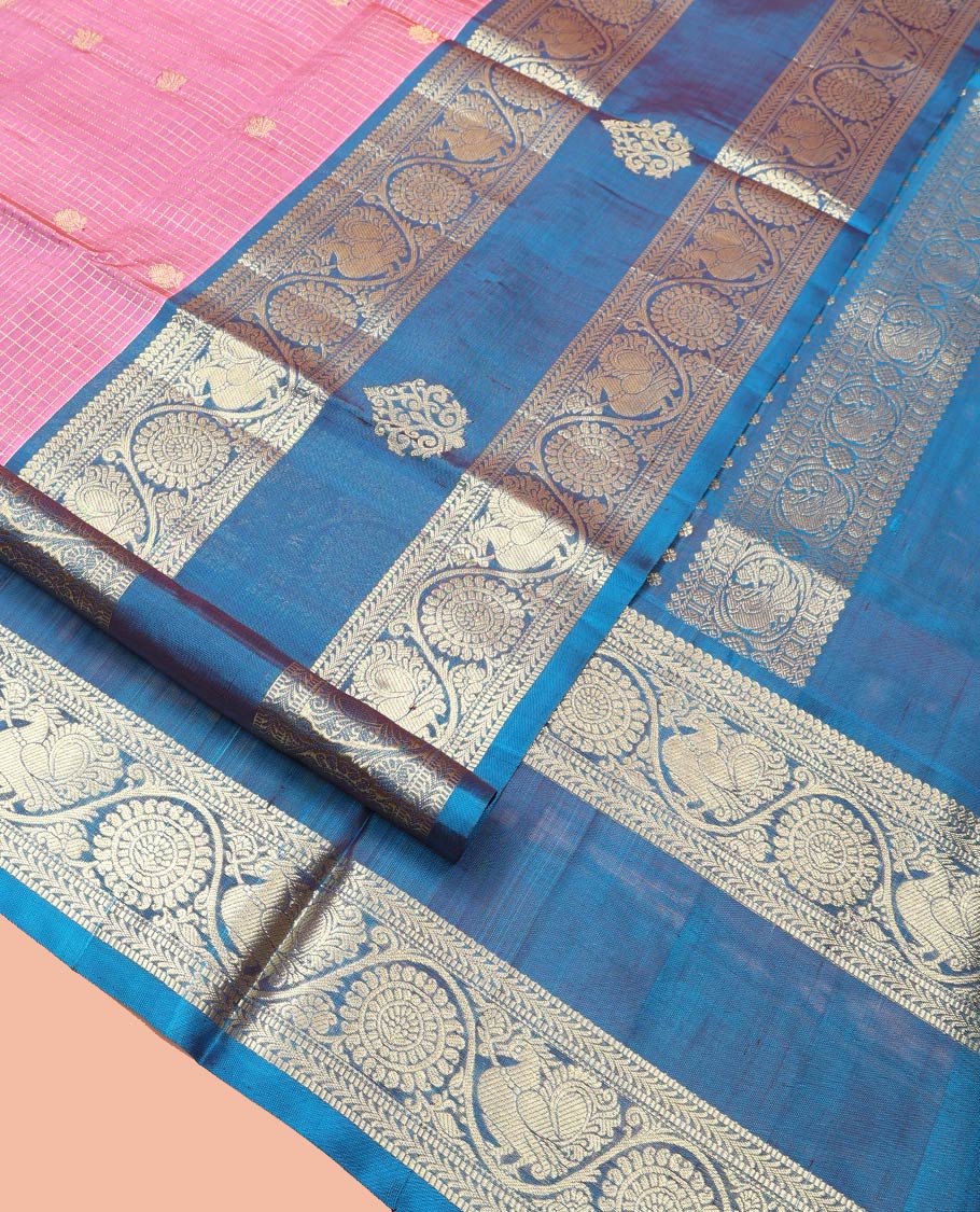Pink Venkatagiri Silk Saree, Enlivened with Zari Buttas Enclosed Checks All Over Its Body, Complemented by a Contrast Traditional Zari Design Border of Peacock-Chakram Designs, Traditional Design Pallu, and Paired with a Contrast Blouse