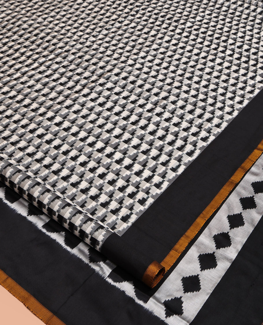 Black and White Pochampally Ikat Silk Saree, Spotlighted with Geometric Patterns on Its Body, Complemented by Contrast Border, Pallu of Diamond Patterns, and Paired with a Contrast Blouse