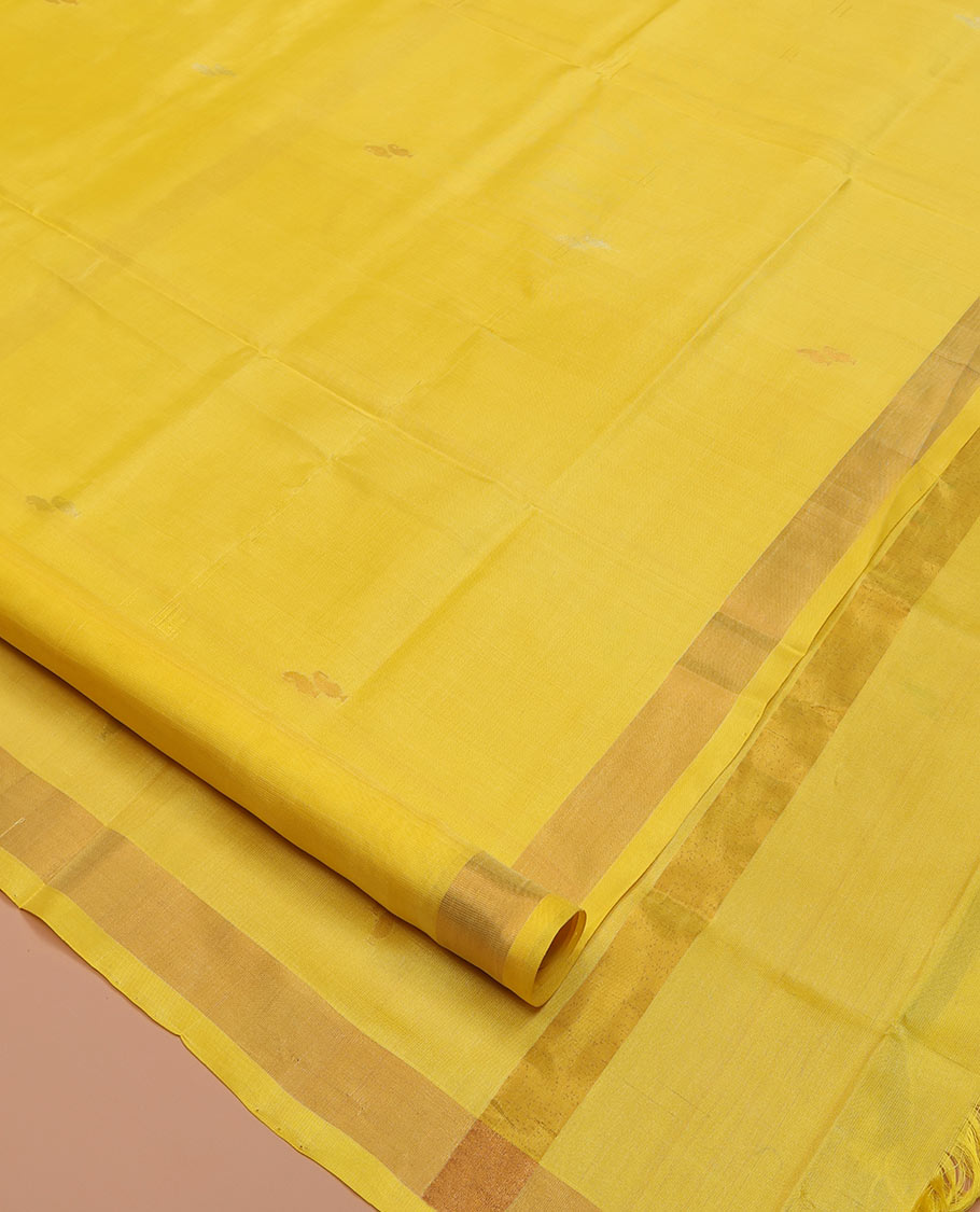 Yellow Uppada Silk Saree, Sparsely Woven with Buttas All Over Its Body, Subtle Bavanji Border, Pallu Steeped with Paisley Buttas, and Paired with a Matching Blouse