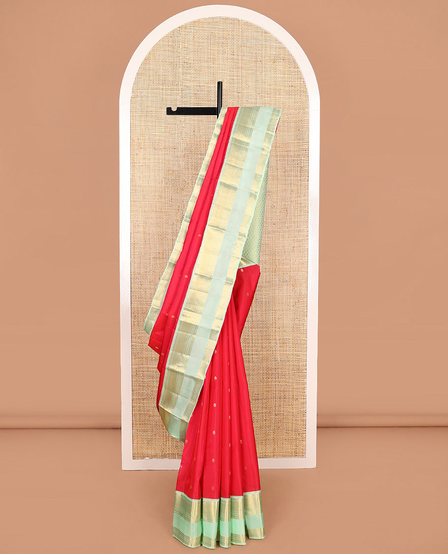Red zari buttas Vasundhara silk mix saree, contrast border of thilakam, kathir, mayil kann, kathir, kamalam, and banaras, and peacock feather motifs pallu