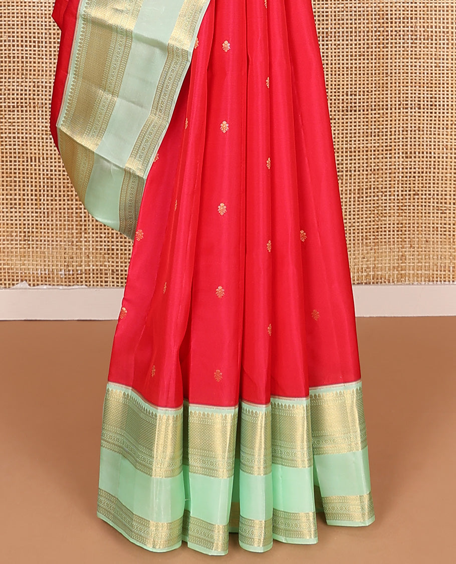 Red zari buttas Vasundhara silk mix saree, contrast border of thilakam, kathir, mayil kann, kathir, kamalam, and banaras, and peacock feather motifs pallu