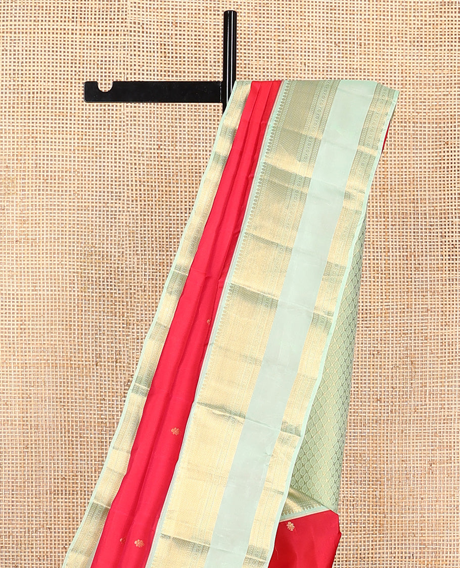 Red zari buttas Vasundhara silk mix saree, contrast border of thilakam, kathir, mayil kann, kathir, kamalam, and banaras, and peacock feather motifs pallu