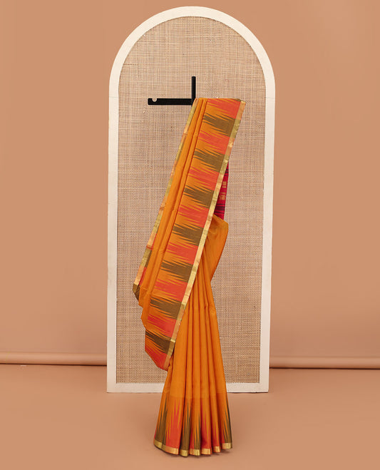 Orange plain Bangalore silk saree, contrast temple zari piping border, and temple design pallu