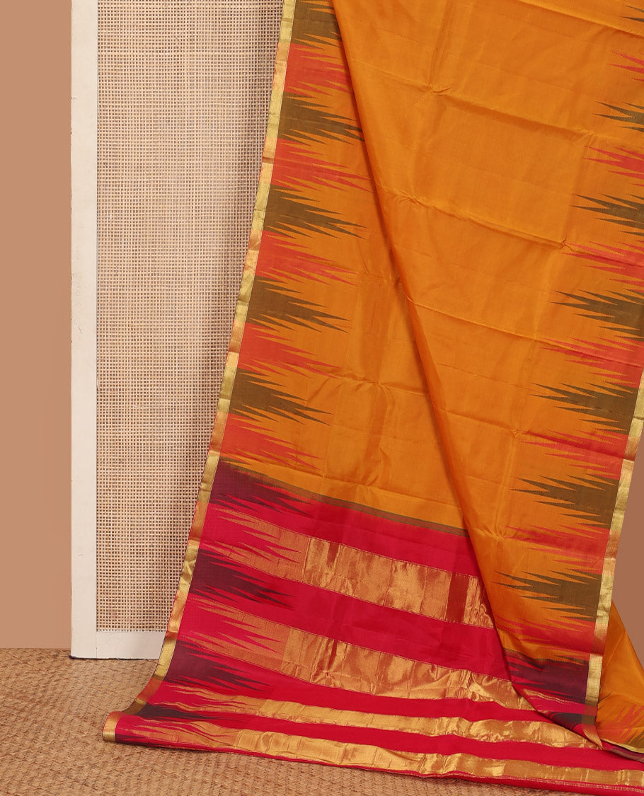 Orange plain Bangalore silk saree, contrast temple zari piping border, and temple design pallu