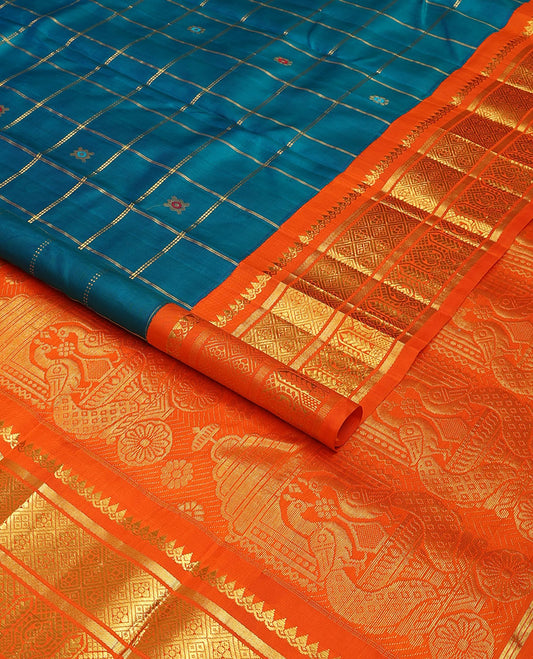 Blue zari buttas enclosed, checked kanchipuram silk saree, contrast one-sided korvai border of thilakam mokku,banaras,jaal & manga & intricate pallu