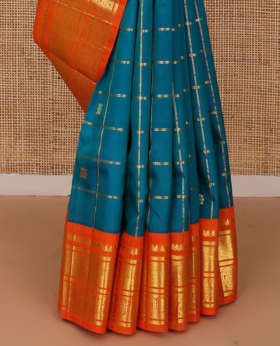 Blue zari buttas enclosed, checked kanchipuram silk saree, contrast one-sided korvai border of thilakam mokku,banaras,jaal & manga & intricate pallu