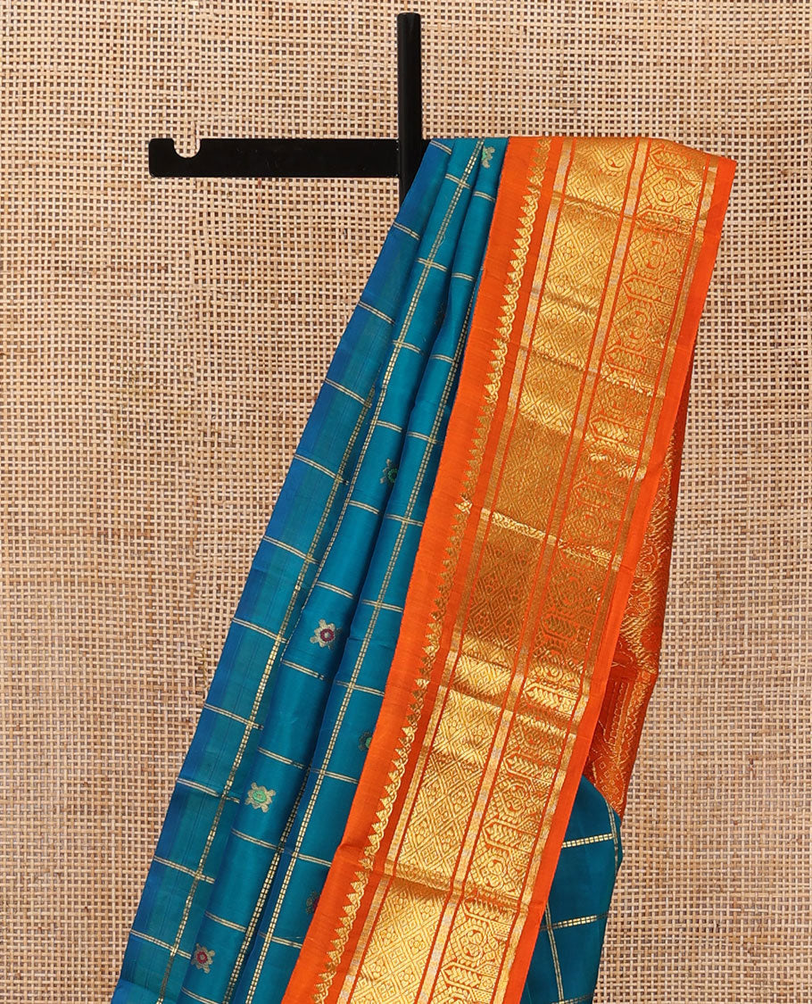 Blue zari buttas enclosed, checked kanchipuram silk saree, contrast one-sided korvai border of thilakam mokku,banaras,jaal & manga & intricate pallu