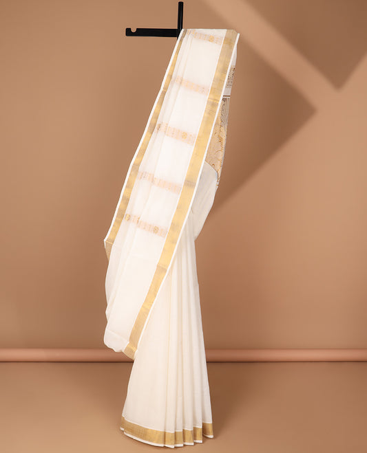 Cream kerala saree with zari designs, plain border & pallu of intricate zari designs