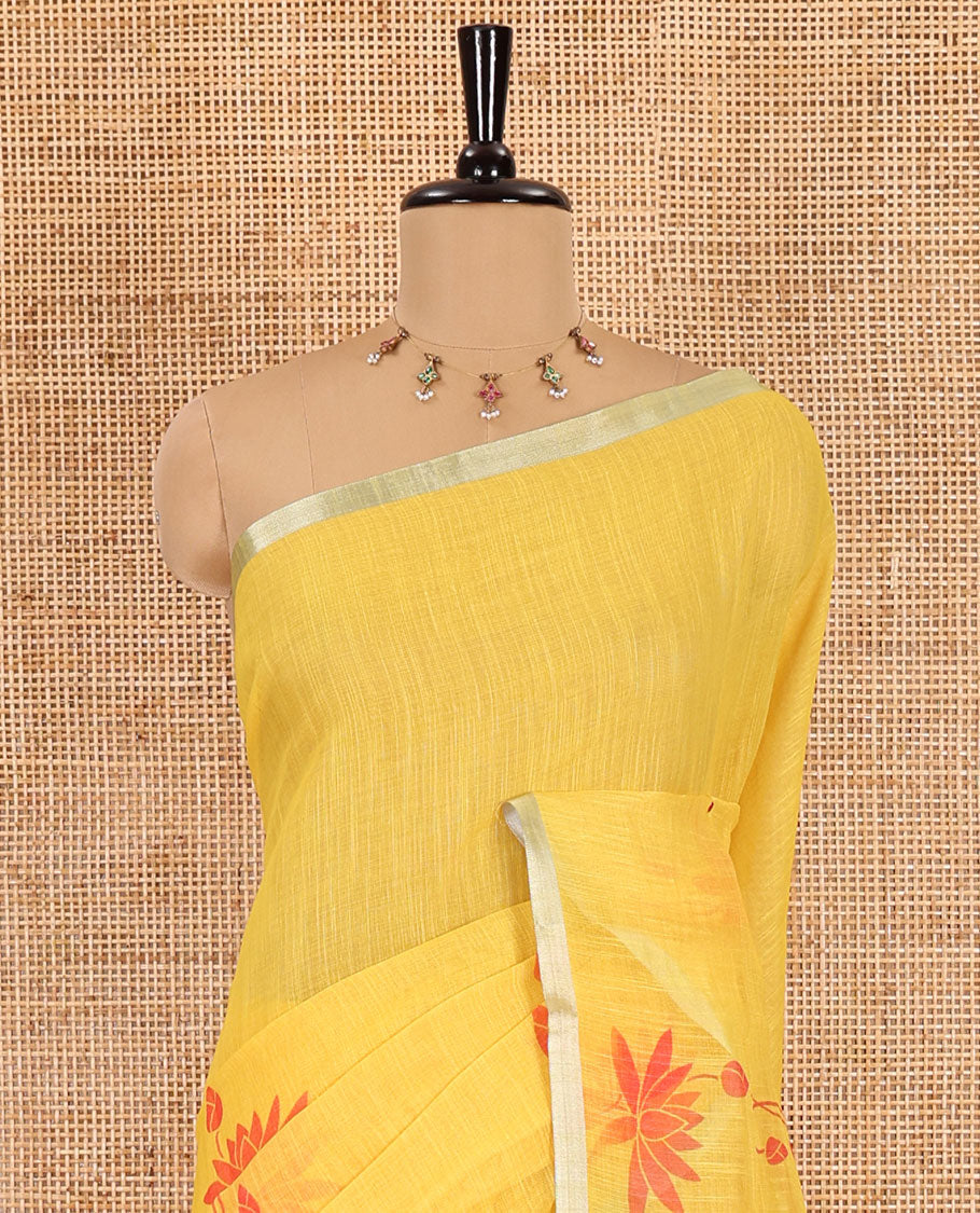 Yellow Pichwai lotus printed linen cotton saree, piping zari border, colorful tasselled lotus printed pallu, and a contrast lotus printed blouse