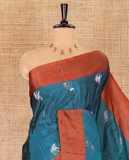 Blue dobby and elephant buttas semi-soft silk saree, contrast zari striped border, zari design pallu, and a matching blouse