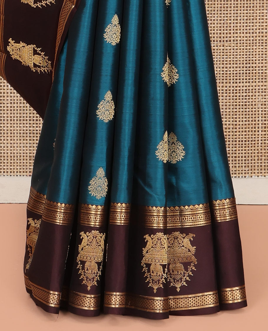 Blue Vasundhara Silk Saree, Elegantly Framed with Zari Buttas All Over Its Body, Complemented by a Contrast Border of Thilakam Mokku, Neli, Kathir, and Ara Maadam Designs, Grand Pallu, and Paired with a Contrast Blouse