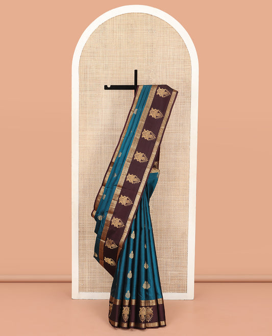 Blue Vasundhara Silk Saree, Elegantly Framed with Zari Buttas All Over Its Body, Complemented by a Contrast Border of Thilakam Mokku, Neli, Kathir, and Ara Maadam Designs, Grand Pallu, and Paired with a Contrast Blouse