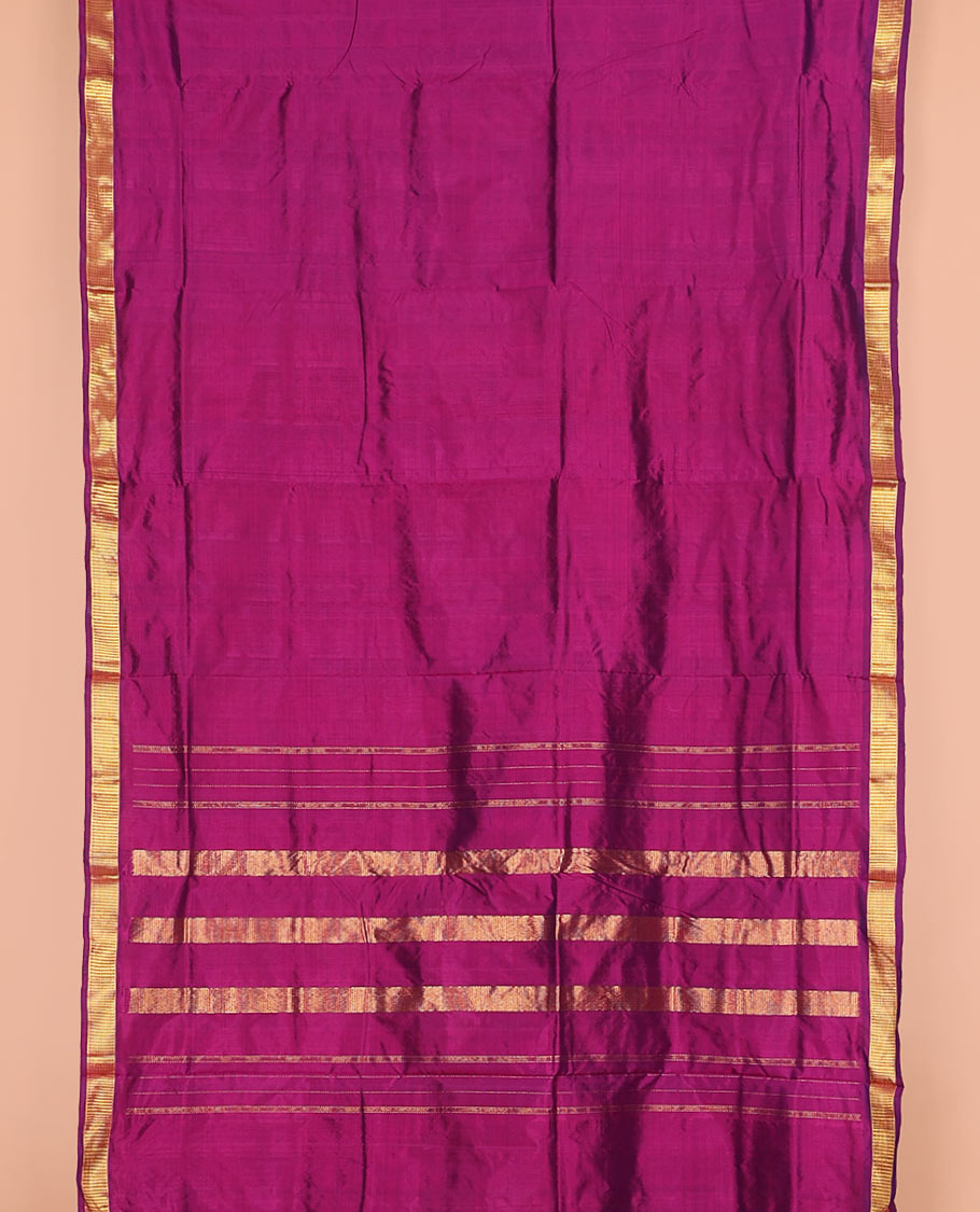 Magenta plain nine-yard silk saree, zari border, and pallu of zari designs