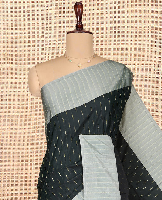Green Aarani Gift Saree, Steeped with Zari Buttas on Its Body, Complemented by a Contrast Zig-Zag Striped Border, Pallu of Stripes and Buttas, and Paired with a Matching Blouse