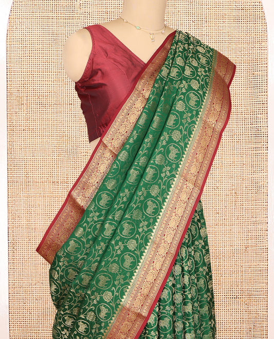 Green Mysore Silk Saree, Embellished with Lotus Vine and Pichwai Cow Designs, Complemented by a Contrast Traditional Zari Border, Grand Pallu, and a Contrast Blouse