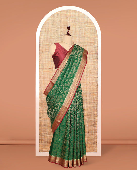 Green Mysore Silk Saree, Embellished with Lotus Vine and Pichwai Cow Designs, Complemented by a Contrast Traditional Zari Border, Grand Pallu, and a Contrast Blouse