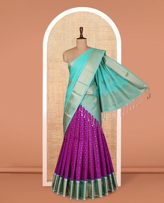 Rani Pink Art Silk Material Half Saree Set, Detailed with Zari Butta Enclosed Checks on Its Skirt, Complemented by Contrast Traditional Zari Design Border, Paired with a Contrast Blouse, and Intricately Designed Dhavani