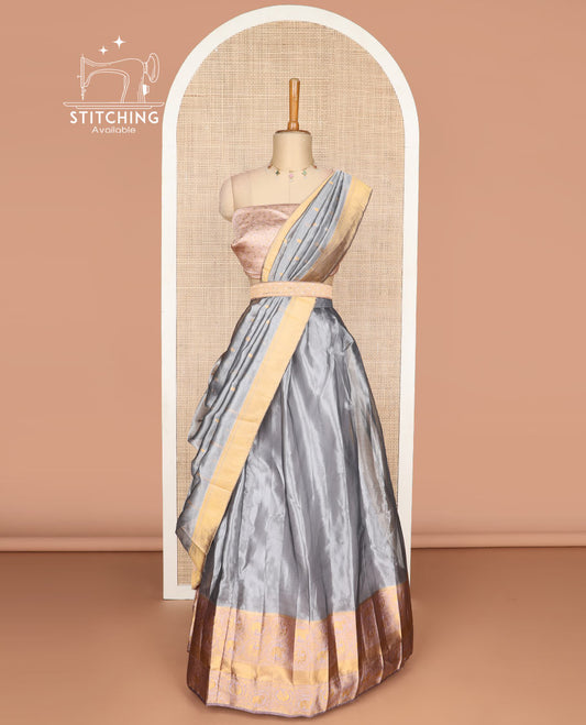 Grey tissue half saree with contrast intricate zari design border, zari design blouse & zari design border dhavani