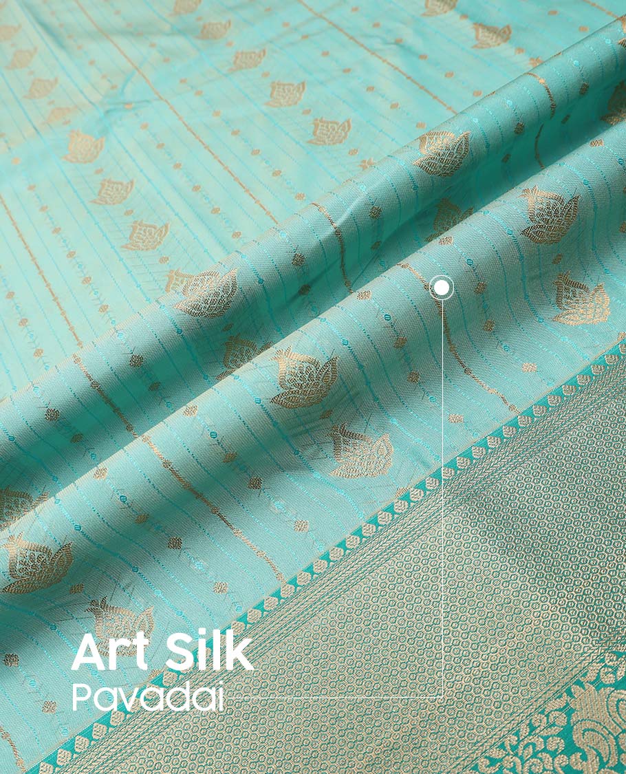 Turquoise art silk pavadai material, zari design with embossed contrast traditional zari border skirt, and contrast blouse