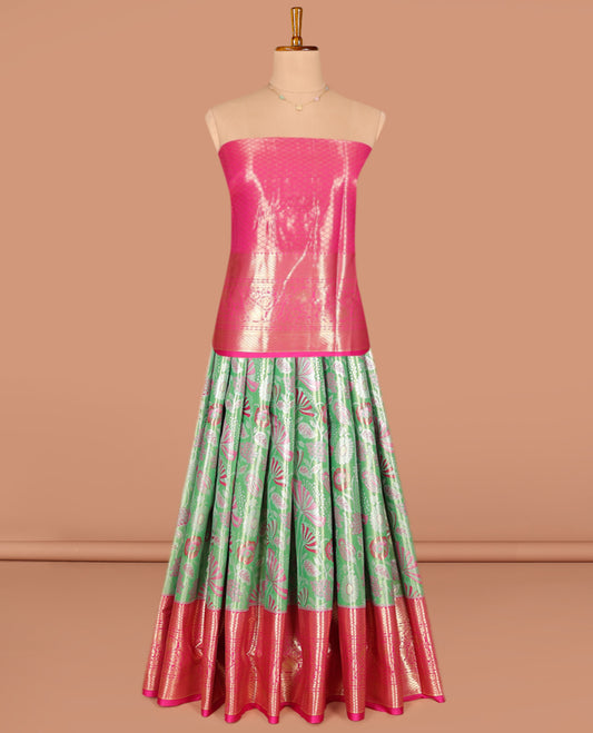 Green Art Silk Pavadai Material Set, Opulently Embellished with Jacquard Designs on Its Skirt, Complemented by a Contrast Traditional Zari Designs Woven Border, and Paired with a Contrast Jacquard Blouse