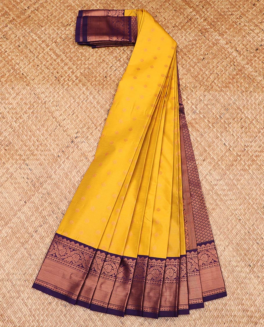 Yellow zari buttas and striped gift saree, contrast traditional zari border, and jaal pallu