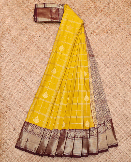 Yellow Budget Silk Saree, Charmingly Accented with Zari Butta Enclosed Checks All Over Its Body, Complemented by a Contrast Traditional Zari Border of Paisleys, Gleaming Jaal-Patterned Pallu, and Paired with a Contrast Blouse