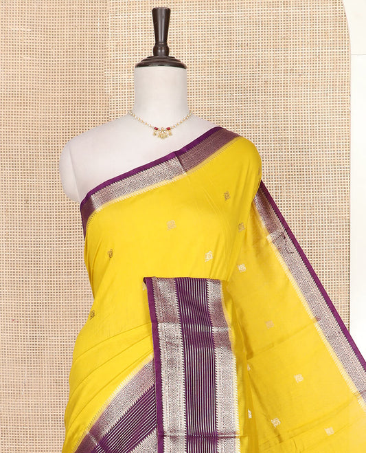 Yellow peacock buttas assam silk saree, contrast traditional zari border, and pallu of zari design