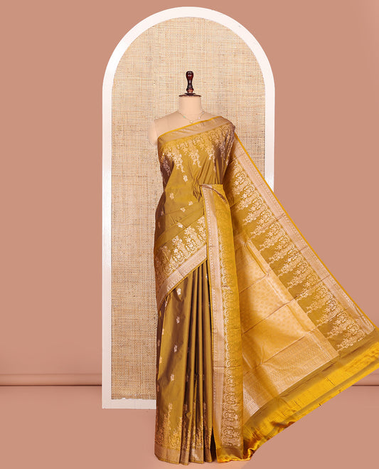 Mustrad Budget Silk Saree, Detailed with Floral Zari Buttas All Over Its Body, Highlighted by a Zari Border of Floral Designs, Grandly Woven Jaal Pallu, and Paired with a Matching Blouse