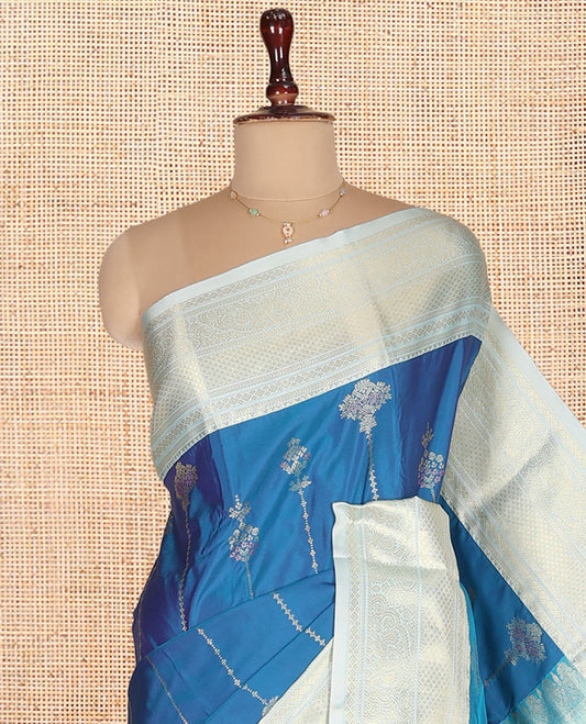 Blue Budget Silk Saree, Steeped in Richness of Zari Buttas on Its Body, Complemented by a Contrast Traditional Zari Design Border, Intricately Designed Pallu, and Paired with a Contrast Blouse