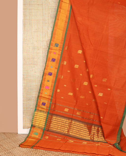 Orange Venkatagiri Cotton Saree, Ornamented with Buttas on Its Body, Complemented by a Contrast Zari and Thread Border, Gleaming Zari-Striped Pallu, and Comes Without a Blouse