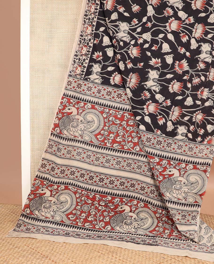 Black pichwai cow and lotus machine printed kalamkari cotton saree, contrast pichwai cow border, and pallu of peacock-geometric print