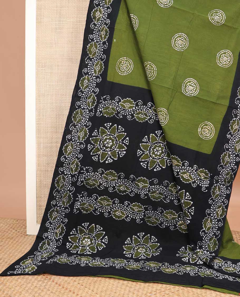 Olive green batik printed sungudi cotton saree, contrast floral creeper batik border, and pallu