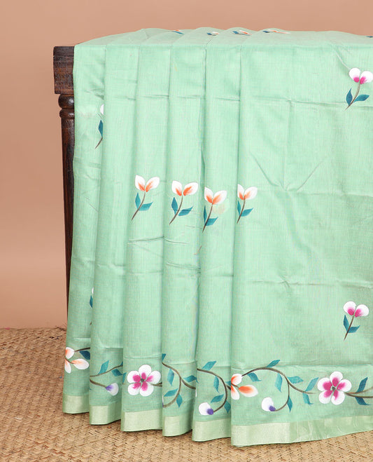 Green colorful floral motifs printed jute cotton saree, bavanji border, and contrast floral vine printed pallu