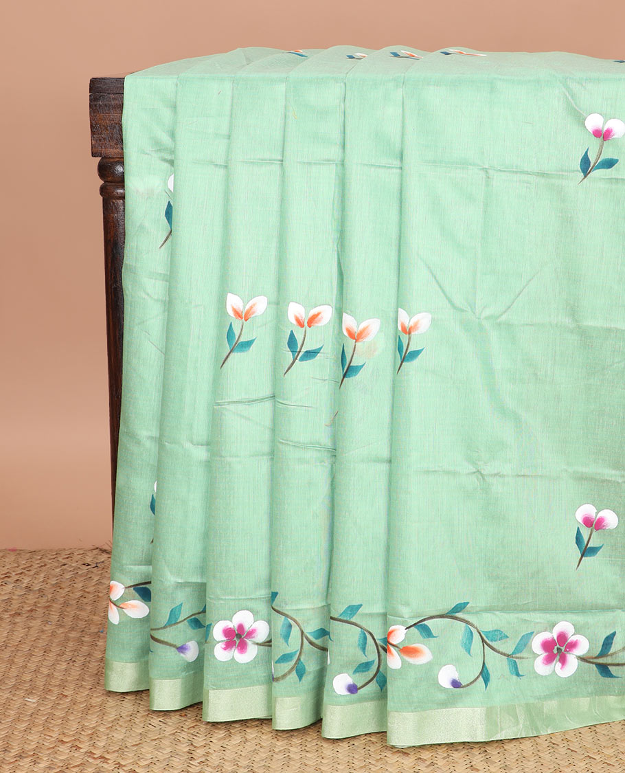 Green colorful floral motifs printed jute cotton saree, bavanji border, and contrast floral vine printed pallu