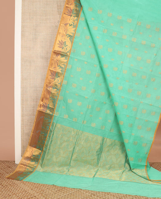 Turquoise zari buttas Venkatagiri cotton saree, contrast zari floral creeper border, and pallu of leaf designs