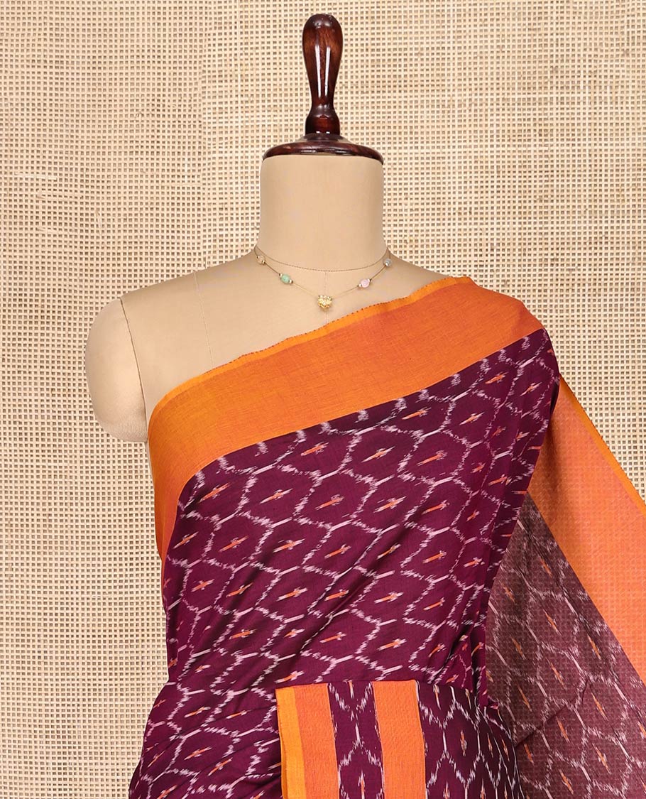 Maroon Ikkat Cotton Saree, Decked Up with Ikkat-Style Ogee Patterns on Its Body, Complemented by Contrast Border, Pallu of Chevron Designs, and Has No Blouse