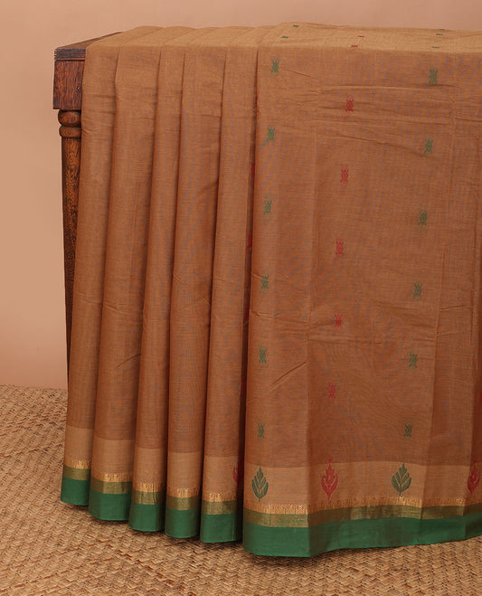 Brown kanchi cotton saree with thread buttas, contrast temple zari border & pallu of floral designs