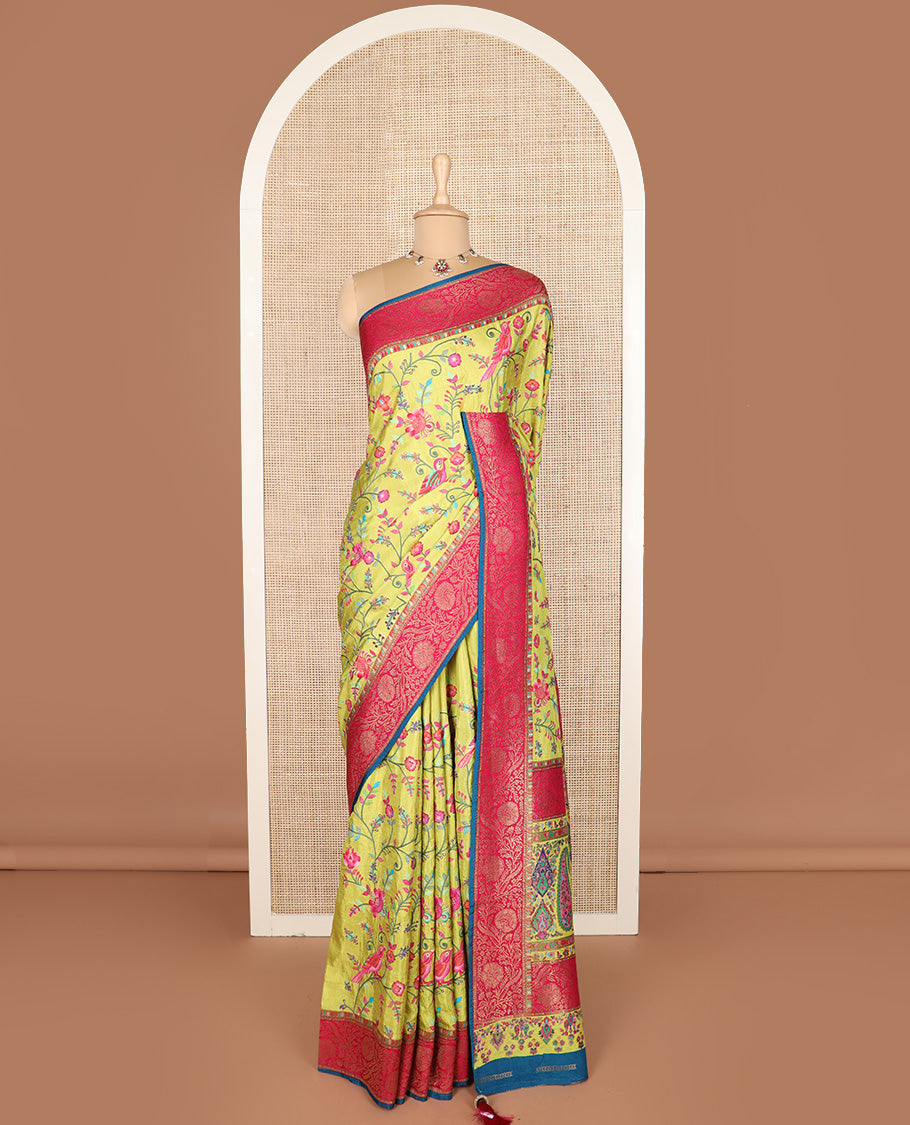 Green colorful floral vine and bird digital printed dola silk saree, contrast floral zari border, and meenakari paisleys pallu