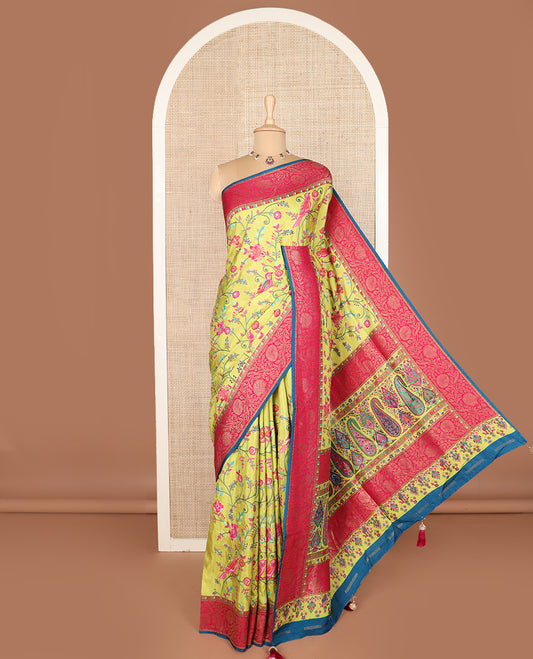 Green colorful floral vine and bird digital printed dola silk saree, contrast floral zari border, and meenakari paisleys pallu