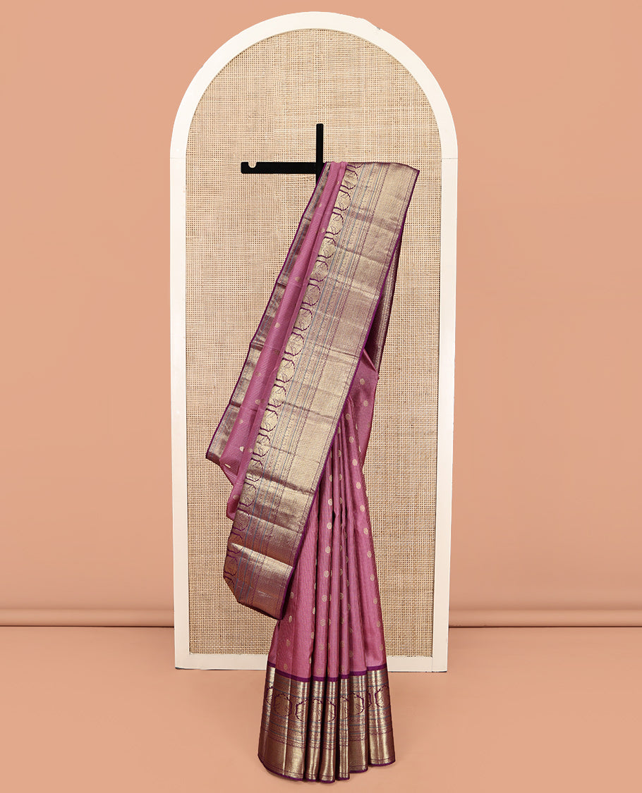 Pink Vasundhara Silk Saree, Elevated with Zari Stripes and Chakram Buttas All Over Its Body, Complemented by a Contrast Border of Rekku, Muthu, Kamalam and Mayil Kann Designs, Grand Geometric Patterned Pallu, and Paired with a Contrast Blouse