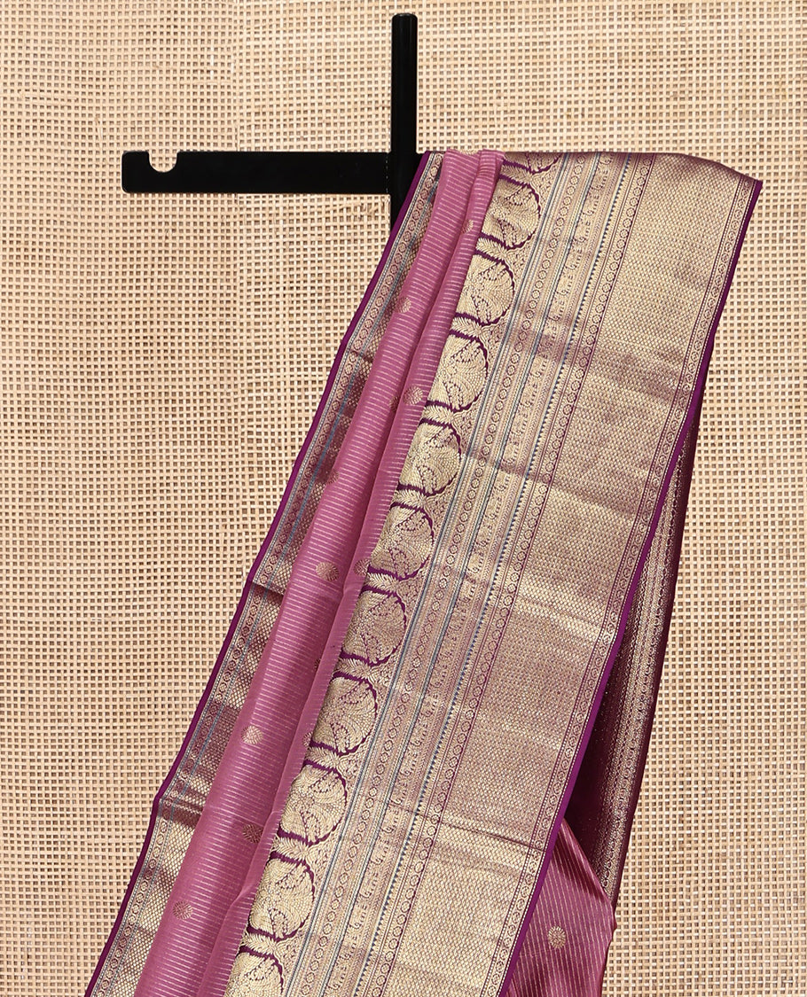Pink Vasundhara Silk Saree, Elevated with Zari Stripes and Chakram Buttas All Over Its Body, Complemented by a Contrast Border of Rekku, Muthu, Kamalam and Mayil Kann Designs, Grand Geometric Patterned Pallu, and Paired with a Contrast Blouse