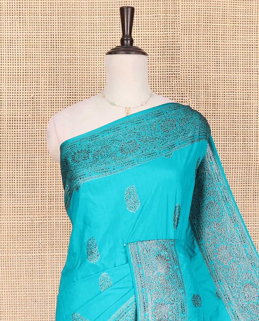 Blue Fancy Georgette Saree Woven with Zari Buttas, Hazily Zari Woven Border of Floral Creeper Designs, Zari Woven Pallu of Floral Jaal Designs, and Paired with a Matching Blouse